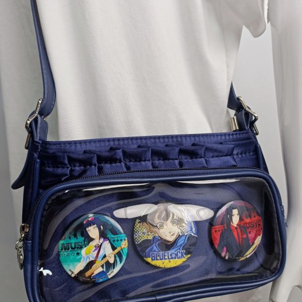 Blue Ita Crossbody Bag with Clear Window and Included Insert for Pin Display — crossbody ita bag detail view