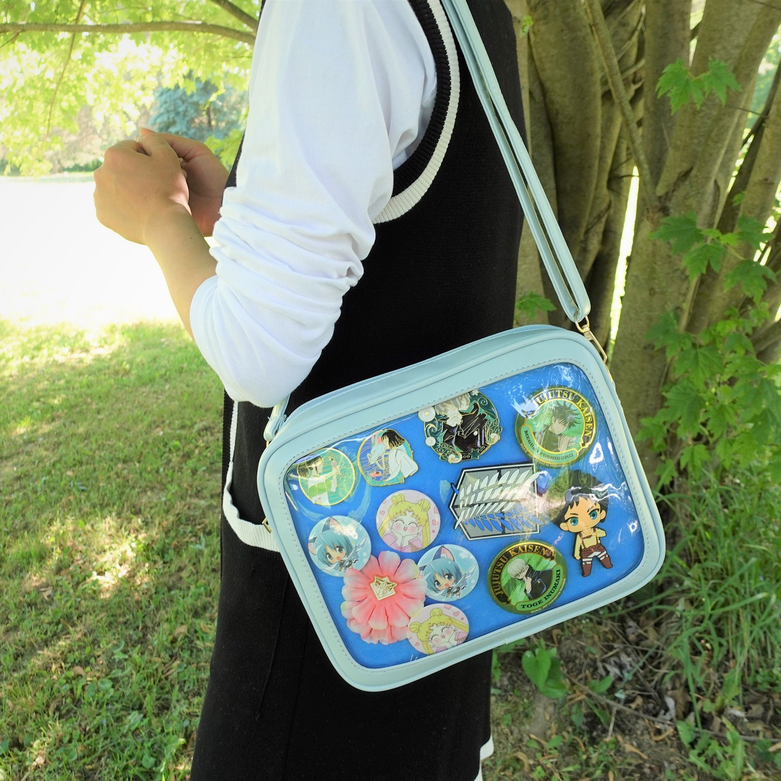 Gold Ita Crossbody Bag with Clear Window and Included Insert for Pin Display Gold Ita Crossbody Bag with Clear Window and Included Insert for Pin Display — crossbody ita bag detail view