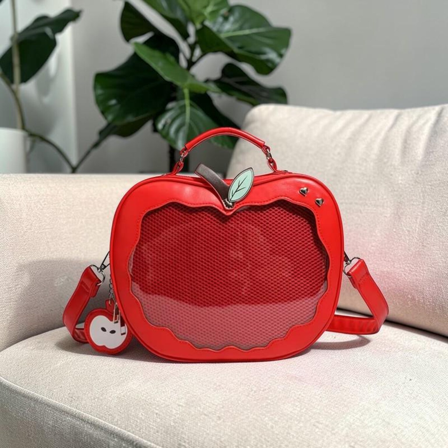 Red Apple Convertible Ita Bag with Clear Window for Pin Display Red Apple Convertible Ita Bag with Clear Window for Pin Display — ita bag detail view
