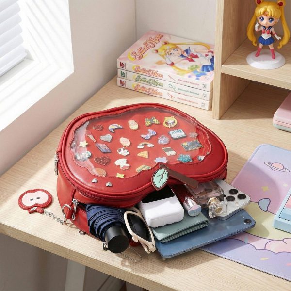 Red Apple Convertible Ita Bag with Clear Window for Plushies and Pins — ita bag detail view
