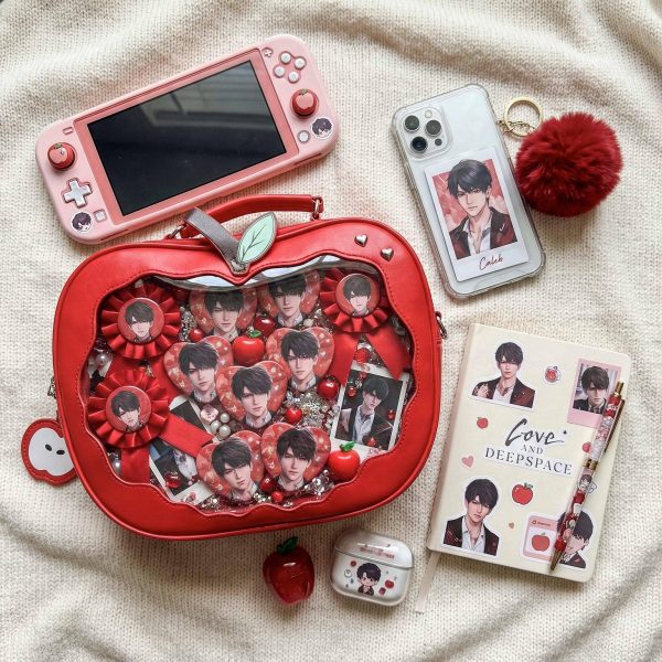 Red Apple Convertible Ita Bag with Clear Window for Plushies and Pins — ita bag detail view