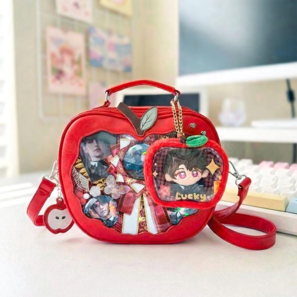 Red Apple Convertible Ita Bag with Clear Window for Plushies and Pins — ita bag detail view