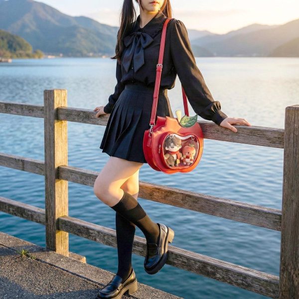 Red Apple Convertible Ita Bag with Clear Window for Plushies and Pins — ita bag detail view